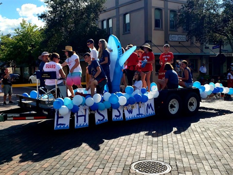 Homecoming Parade Swim Team Sitting and Standing on Trailer in Downtown Eustis