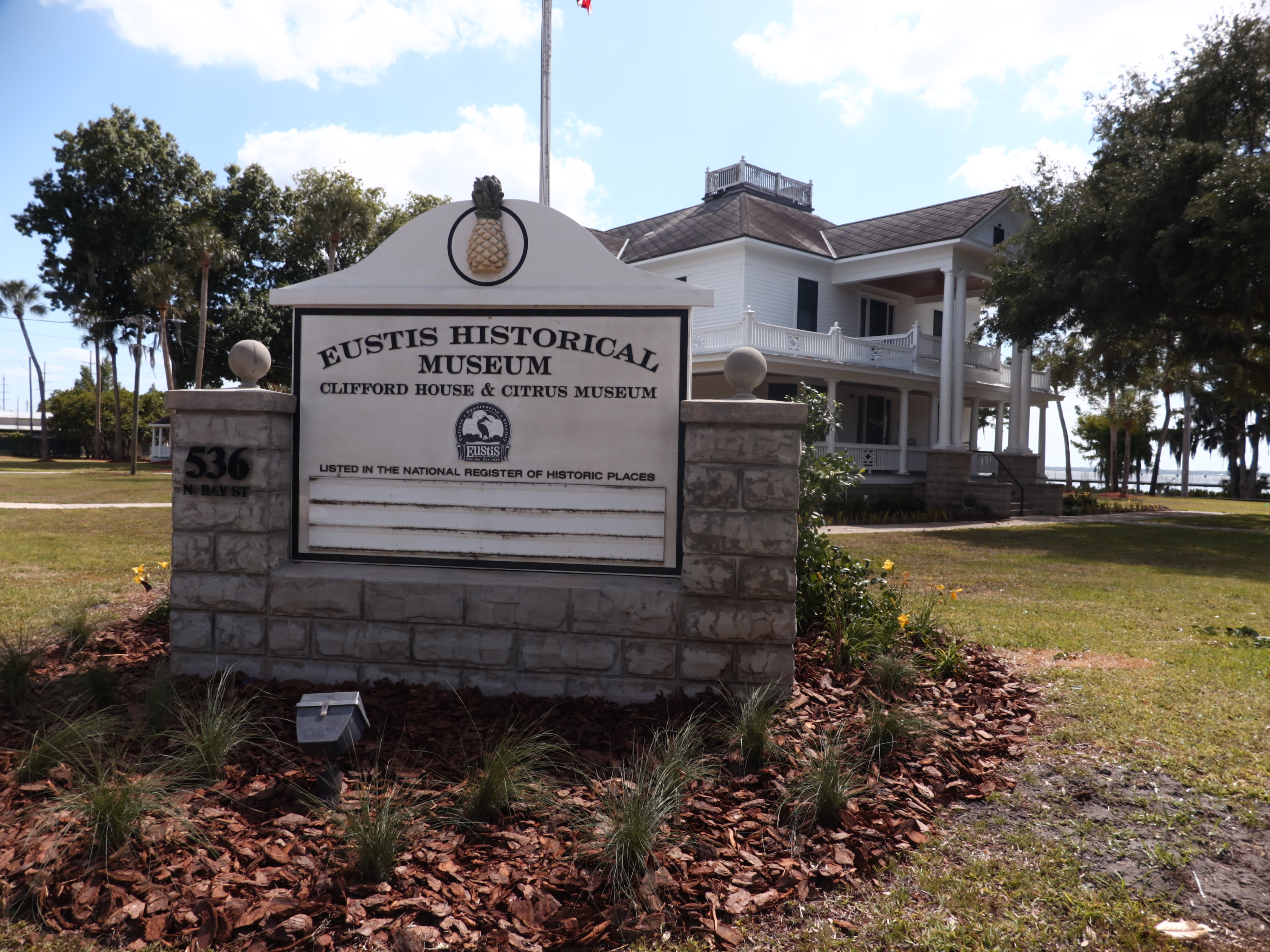 Main Eustis Historic Museum sign with Clifford House in background